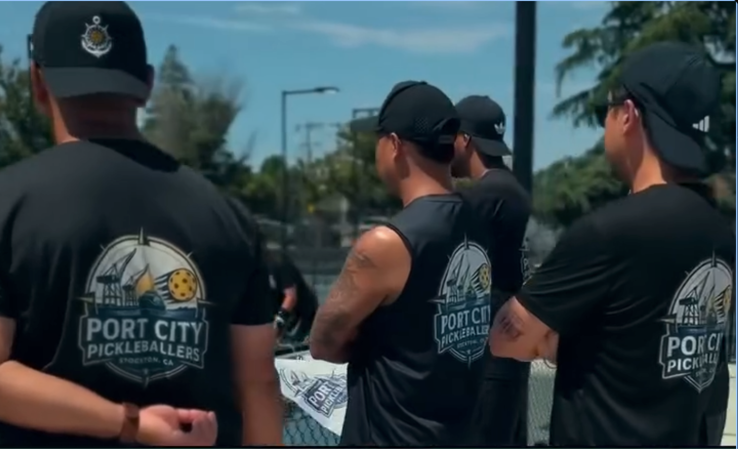 Port City Pickleballers' shirts outdoors